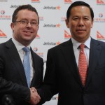 Qantas CEO Alan Joyce (L) and China Eastern Airlines Ltd chairman Liu Shaoyong shake hands at a press conference in Hong Kong 26/03/2012. Both companies will launch a new Hong Kong based budget airline in 2013 aimed at cashing in on China's booming aviation market.